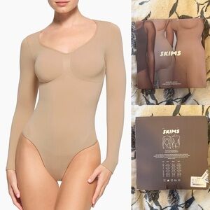 SKIMS Seamless Sculptwear Long Sleeve Thong
Bodysuit in Clay size Large